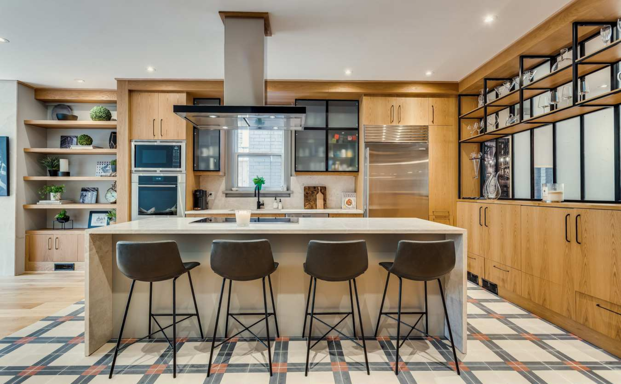 Customized Kitchen, the use of metal details with cabinetry work, island and tile flooring details