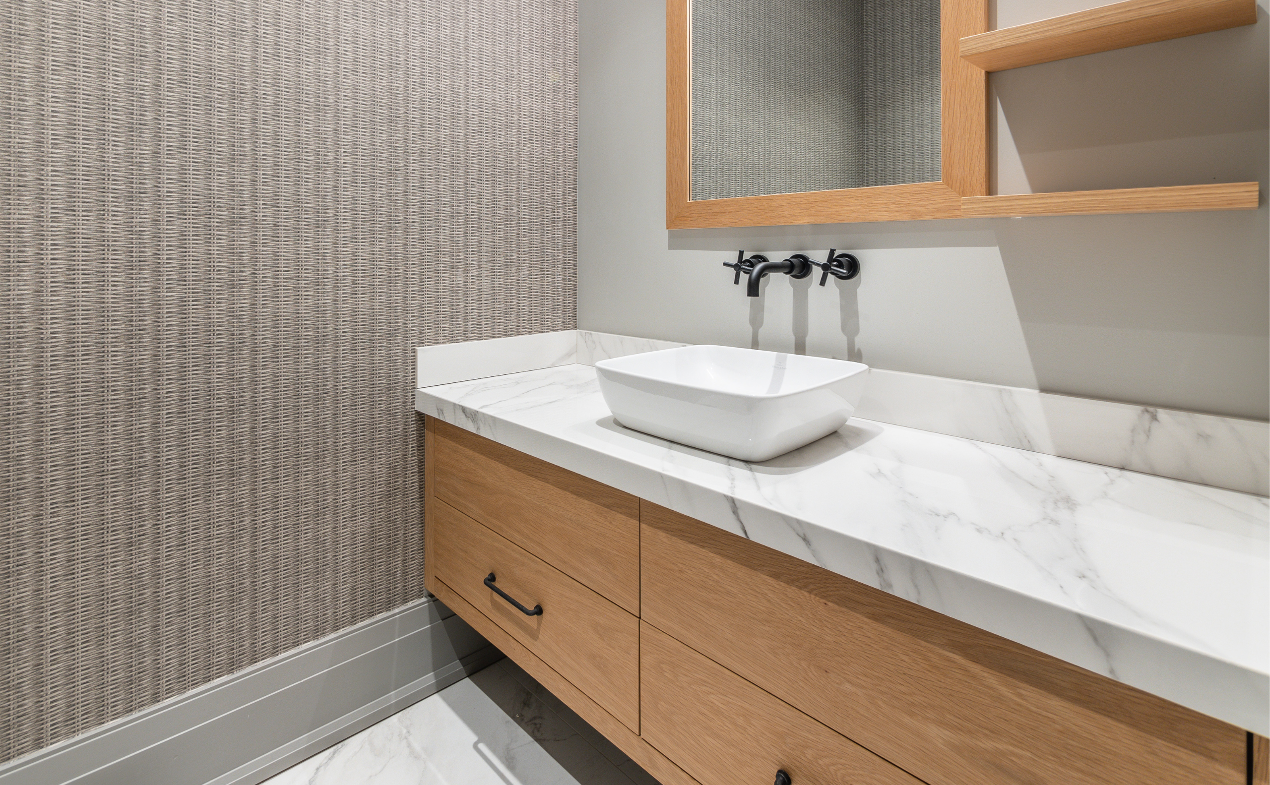 Bathroom remodeling side view, with single bowl sink and wallpaper details